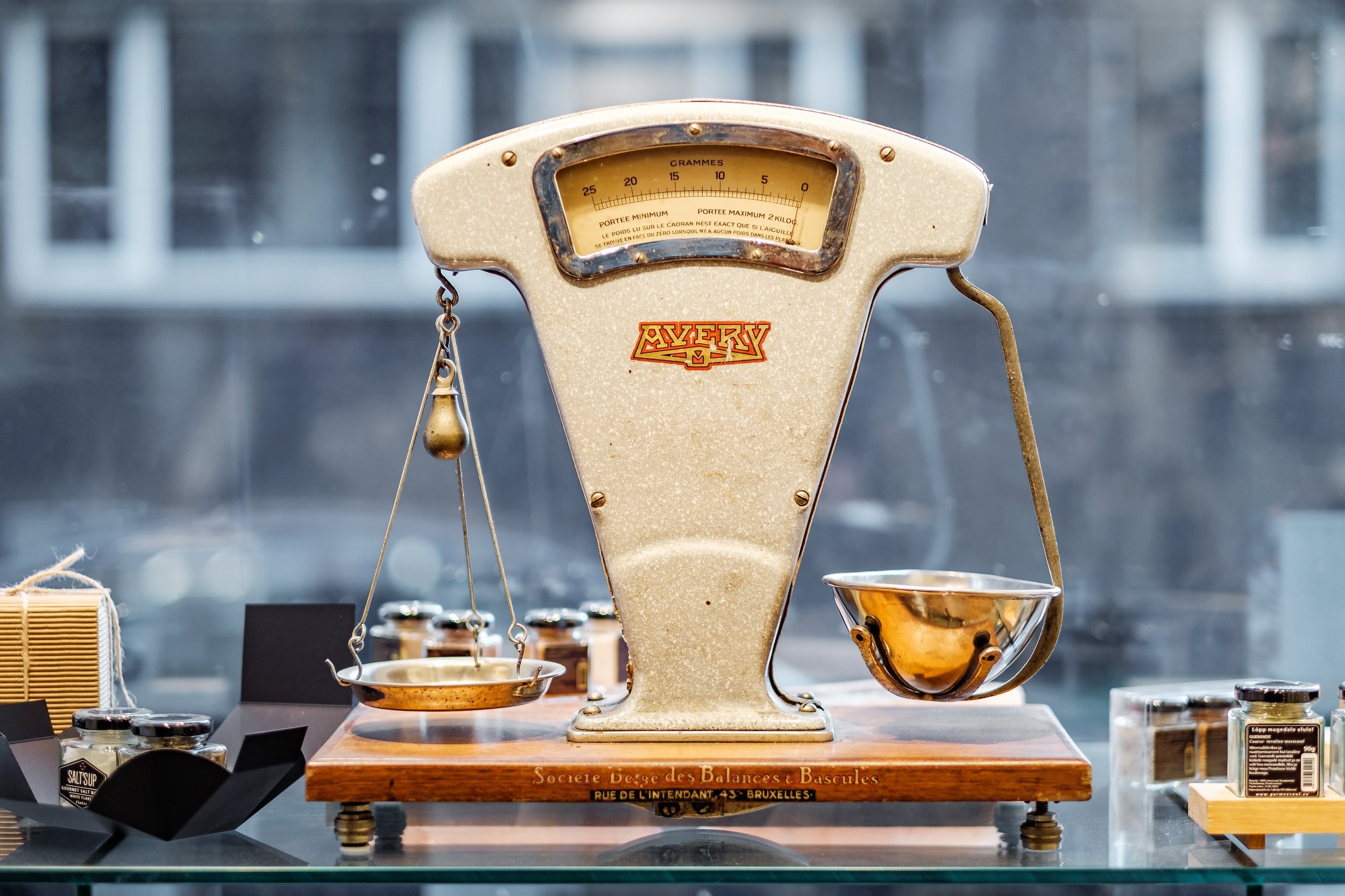 An antique balance scale in a shop display